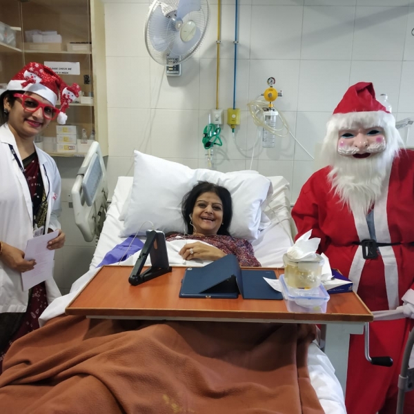 Director Nursing- Ms. Prajakta Hindlekar greeting patients with Santa.